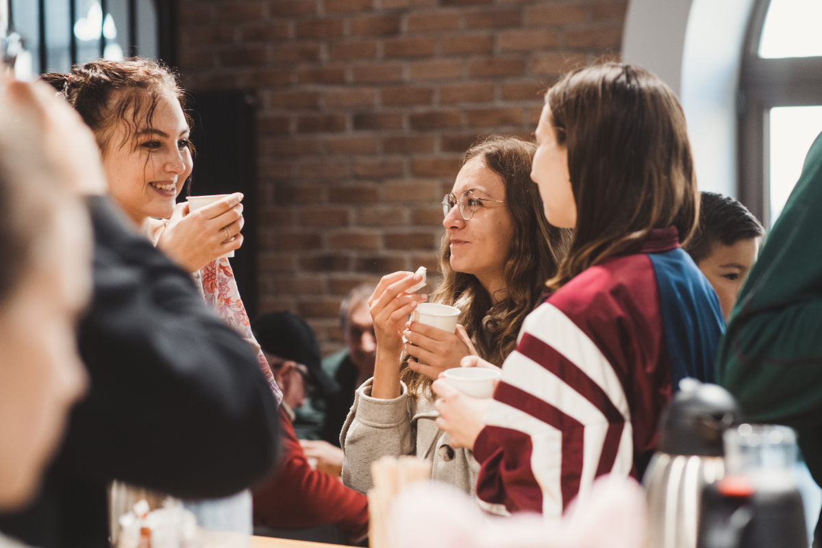Women chat over coffee